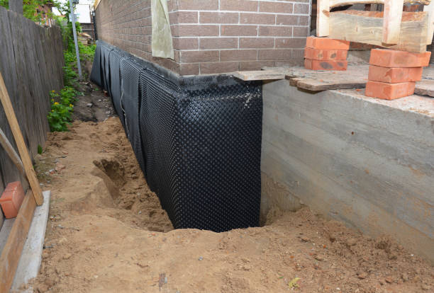 Happy homeowners after waterproofing job in Brownstown